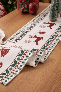 Detailed Christmas table runner featuring red reindeer and snowflake prints on fabric