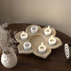 Detailed view of lotus flower candle holder with six tea lights on wooden surface
