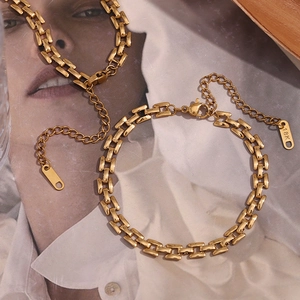 Detail of 18K gold plated rectangular link chain with lobster clasp and adjustable tag