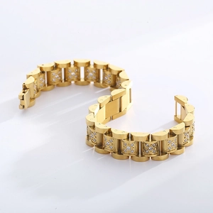 Close-up of golden stainless steel watch band bracelet with micro-pave crystals