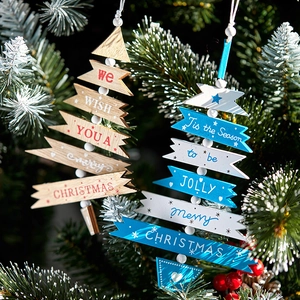 Nautical blue and natural wood Christmas tree hanging ornaments with snowy pine branches
