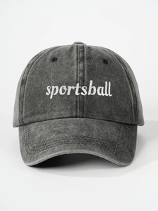 Close-up of white sportsball embroidery on washed grey vintage adjustable cotton baseball cap