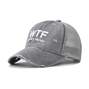 Detail of grey washed trucker hat with WTF embroidery and breathable mesh back