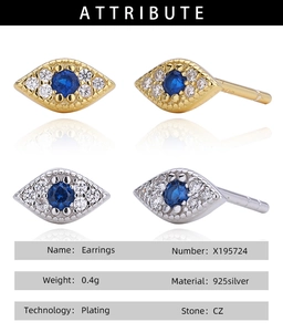 Detailed view of silver and gold 925 silver evil eye stud earrings with blue CZ stone