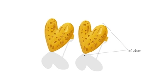 Macro view of gold heart stud earrings featuring a modern textured honeycomb surface