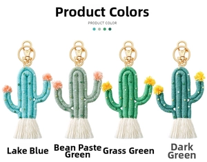 Close-up of handmade cactus keychains in four shades of green with boho tassels