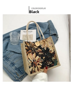 Close-up of linen tote bag with woven sunflower pattern and thick rope handles