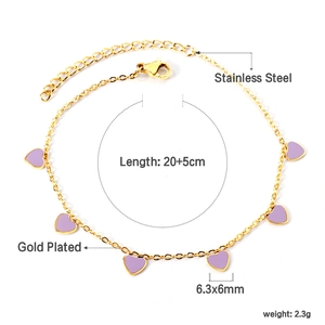 Detail of a gold-plated stainless steel anklet featuring a purple enamel heart charm