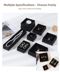 Macro shot of assorted kraft jewelry boxes with black flocking lining in black and brown
