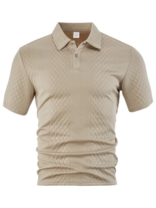 Detail shot of men's polo shirt showing beige geometric jacquard texture and M size label