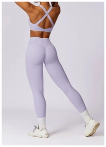 Rear view of lavender purple yoga set with cross-back sports bra and high-waist leggings
