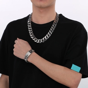 Men's 20mm Cuban link chain necklace and bracelet set in polished silver stainless steel