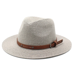 Panama style woven straw sun hat with wide brim and brown leather strap detailing