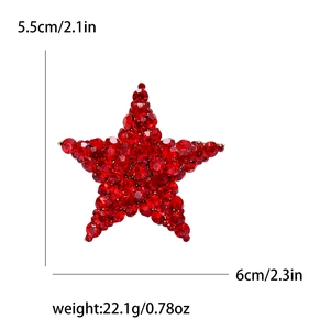 Red crystal star brooch with detailed height, width, and weight measurement markings