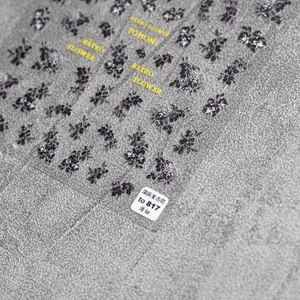Detail view of retro dark grey flower nail stickers with ultra-thin flexible texture