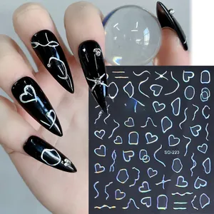 Close-up of holographic silver heart nail stickers SO-223 on black manicured nails