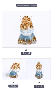 Three-sided view of unicorn resin craft with aquamarine, opal stones, and gold foil