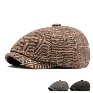 Classic herringbone newsboy cap in brown and grey tweed for autumn and winter styles