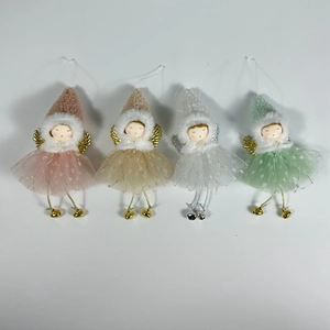 Detailed close-up of Christmas angel ornaments with tulle skirts and knitted hats