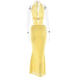 Detailed back view of yellow halter neck top with tie-back and pleated maxi skirt set