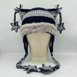 Detail of navy and gray striped knit cat ear hat with star charms and plush faux fur trim
