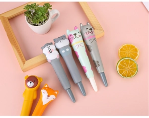 Close-up of cute cartoon animal squishy pens featuring cat and bear stress relief designs