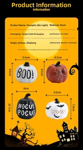 Detailed view of Halloween resin pumpkins featuring Boo and Spooky text patterns