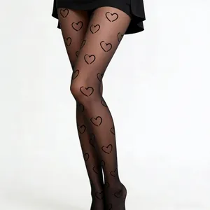 Sheer black pantyhose featuring artistic heart pattern with transparent stretch material