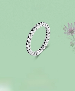 Detailed close-up of S925 sterling silver ring with Forever Love engraving and black hearts