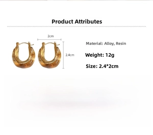 Detail of vintage U-shaped amber resin earrings with dimensions 2.4cm by 2cm