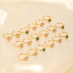 Vintage gold adjustable stainless steel rings with geometric zircon inlays on silk fabric