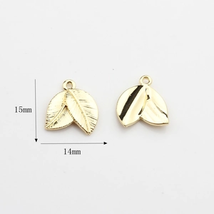 Detailed view of leaf pendant dimensions 15mm by 14mm in polished gold finish