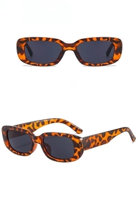 Detail view of rectangular leopard print sunglasses with resin frames and tortoiseshell finish
