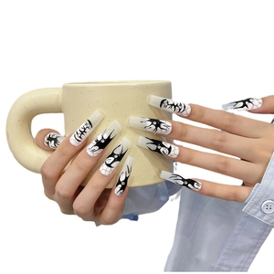 Extra long coffin press-on nails in creamy white with black gothic spider web designs