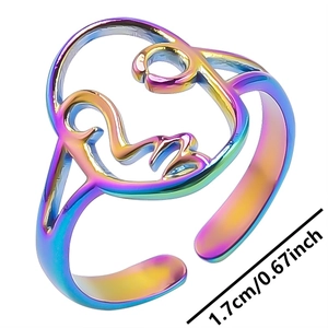 Macro detail of rainbow stainless steel hollow face ring with 1.7cm inner diameter size