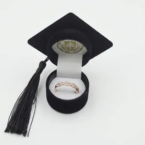 Black velvet graduation cap jewelry box with rose gold crystal ring and black tassel