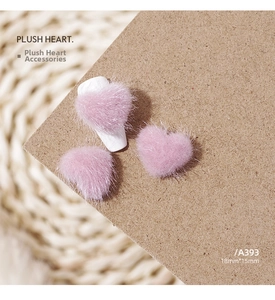 Macro detail of 18mm pink plush heart charms for autumn sweater style nail art
