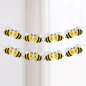 Cute yellow bee banner for baby shower decoration with cartoon honeybee design on white wall