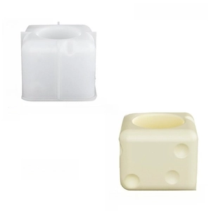 Cube silicone mold and cream-colored geometric toothbrush holder set on white background