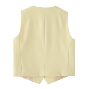 Detail view showing the back seams and symmetric V-cut hem of the beige linen vest