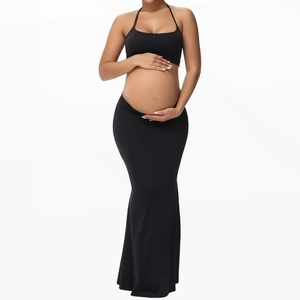 Elegant two-piece maternity set featuring black halter crop top and mermaid long skirt