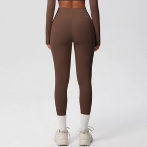 Back view of high-waisted dark brown yoga leggings with seamless quick-dry fabric