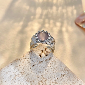 Irregular textured silver stainless steel open ring with round pink cat-eye stone