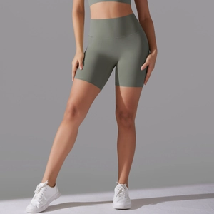Detail of high-waist yoga shorts in olive green with a wide supportive waistband