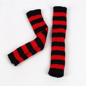 Detailed view of red and black striped knitted arm warmers on a clean white background