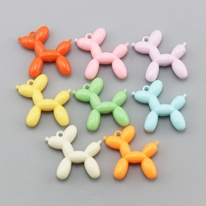 Detailed top view of colorful resin balloon dog pendants for DIY jewelry and crafts
