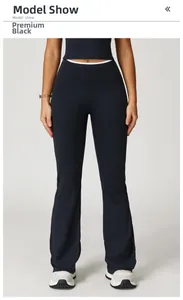 Close-up of high-waisted yoga flare leggings in premium black with white contrast lines