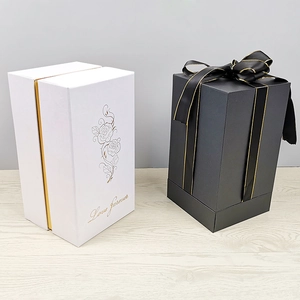 Elegant white rose patterned tall gift box and black square box with gold-trimmed ribbon