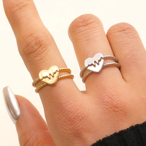 Minimalist heartbeat heart rings in gold and silver finish on twisted rope bands
