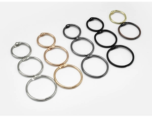 Macro shot of assorted colorful metal binder rings in silver gold and rose gold finishes